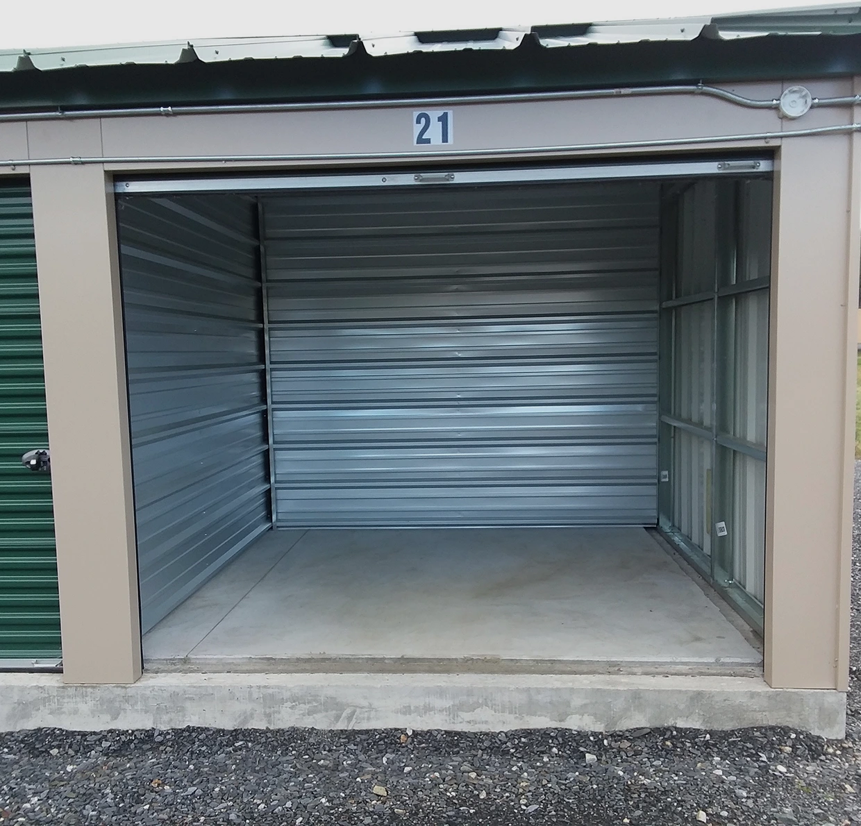 Open empty storage unit with metal walls.